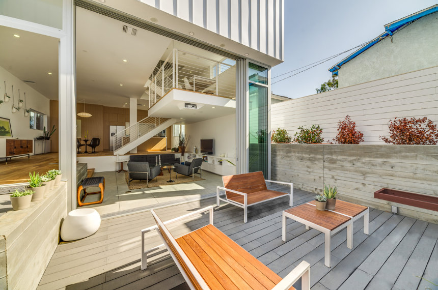 Renovated home opening onto outdoor living space